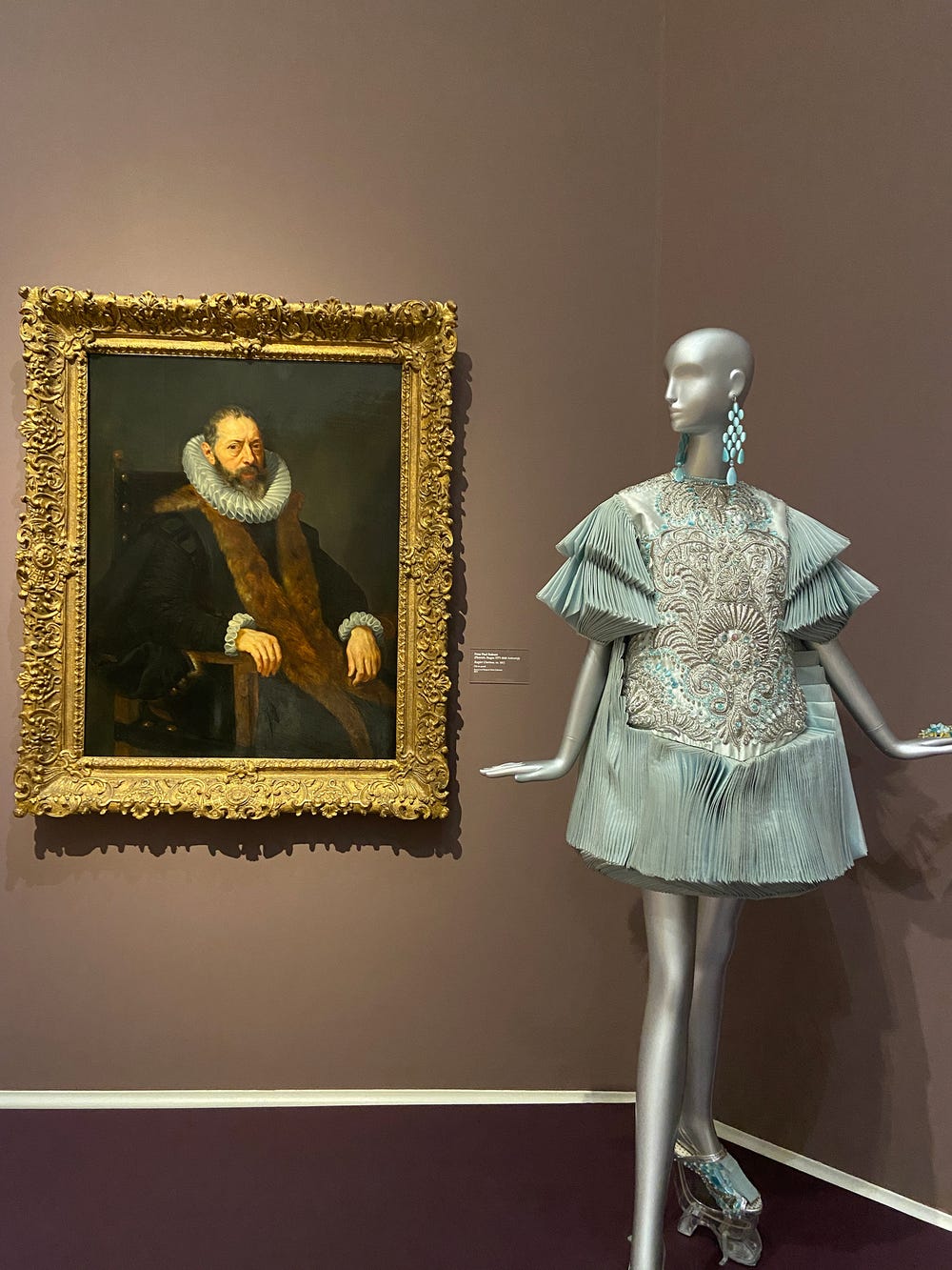 couture gown by Guo Pei next to a painting by Peter Paul Rubens