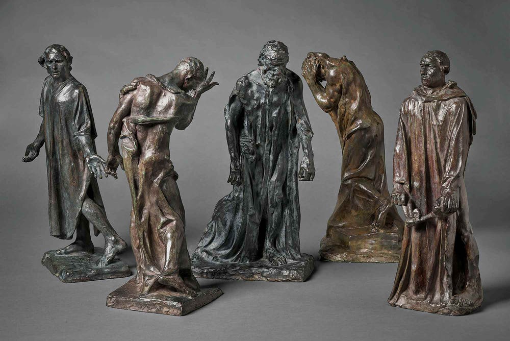 Bronze statues of men wearing robes
