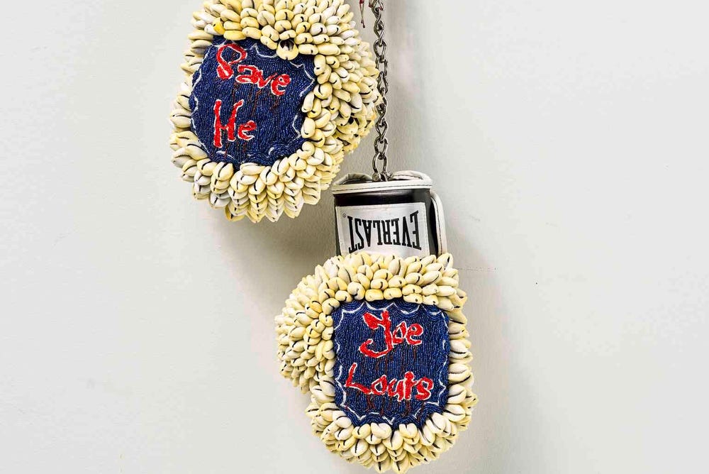 Embellished boxing gloves hanging on a wall