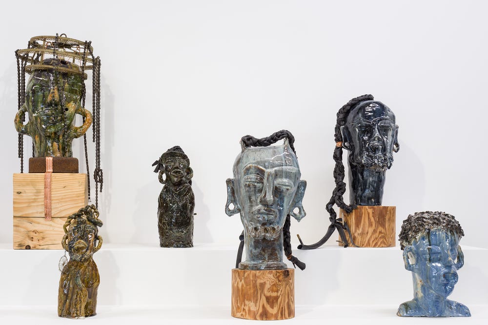 Sculptures by Leilah Babirye displayed in a gallery