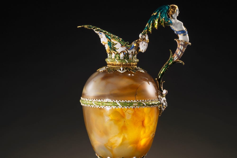 Photograph of gold ewer with green detail.