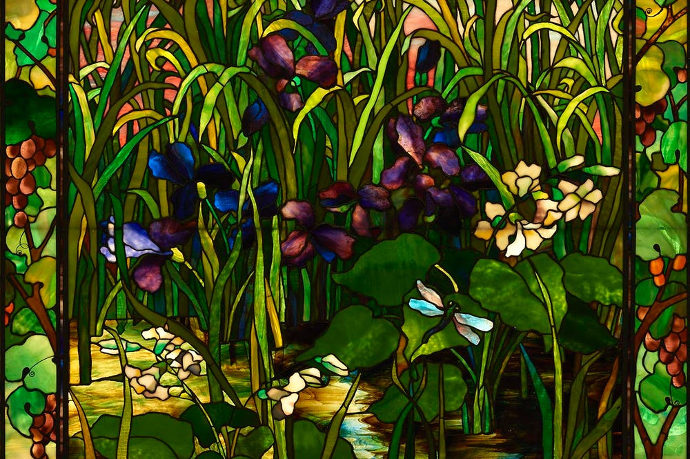stained glass of  irises, lilies, and cattails