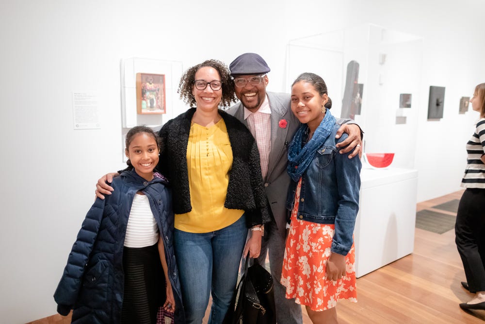 Black family in museum gallery